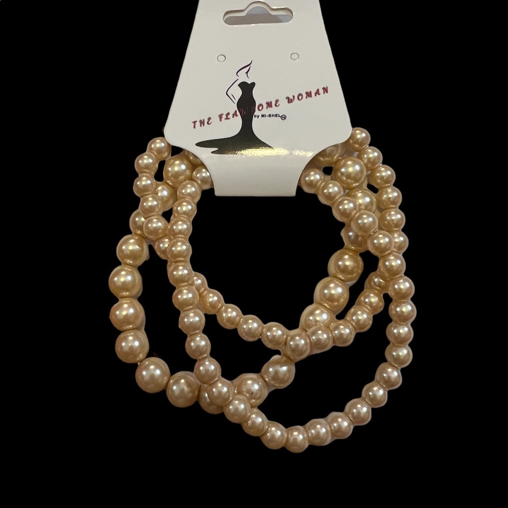 Light tan colored iridescent beaded bracelet set of three stretch bracelets.